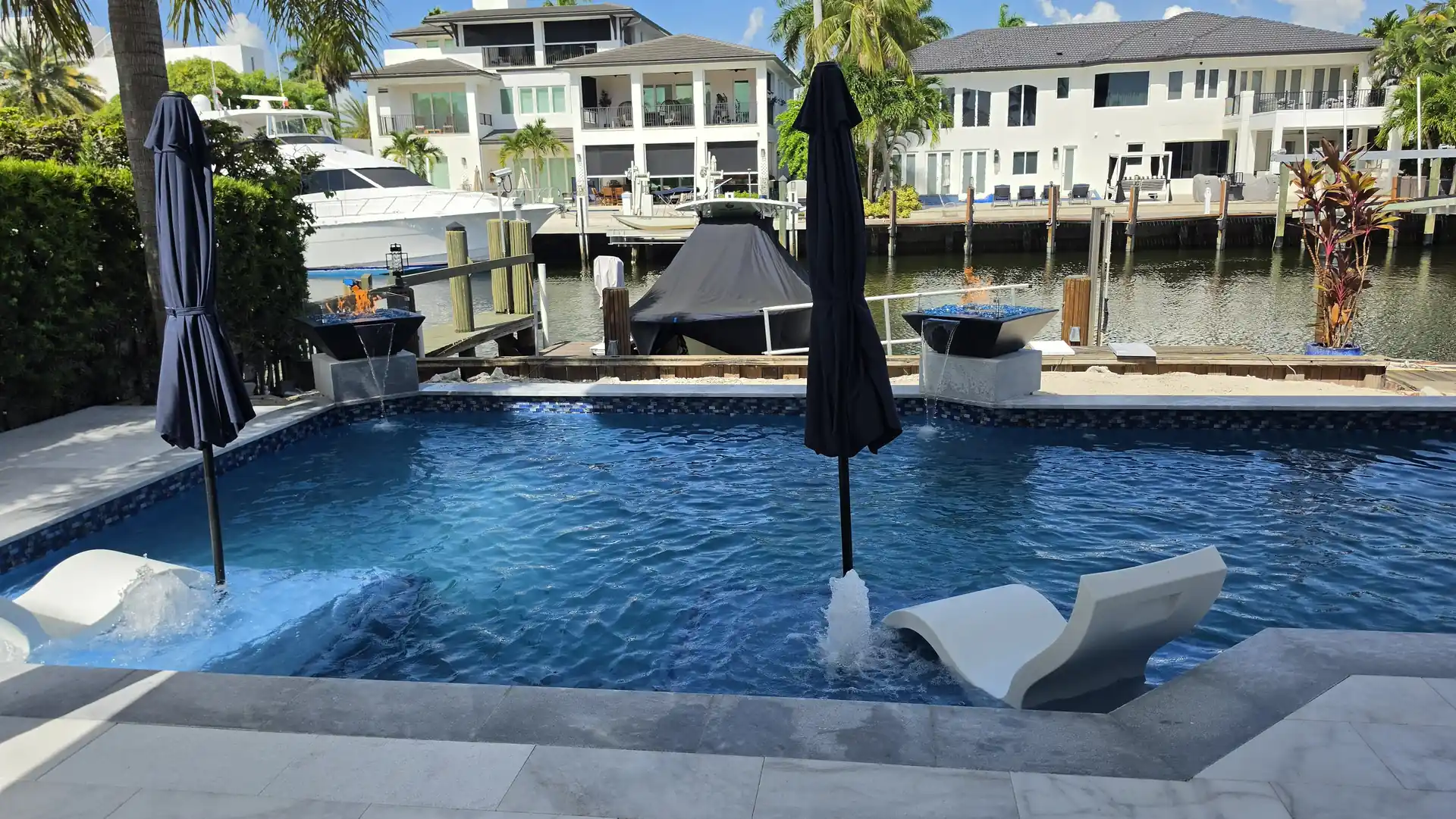 Pool deck with loungers overlooking the Intracoastal Waterway