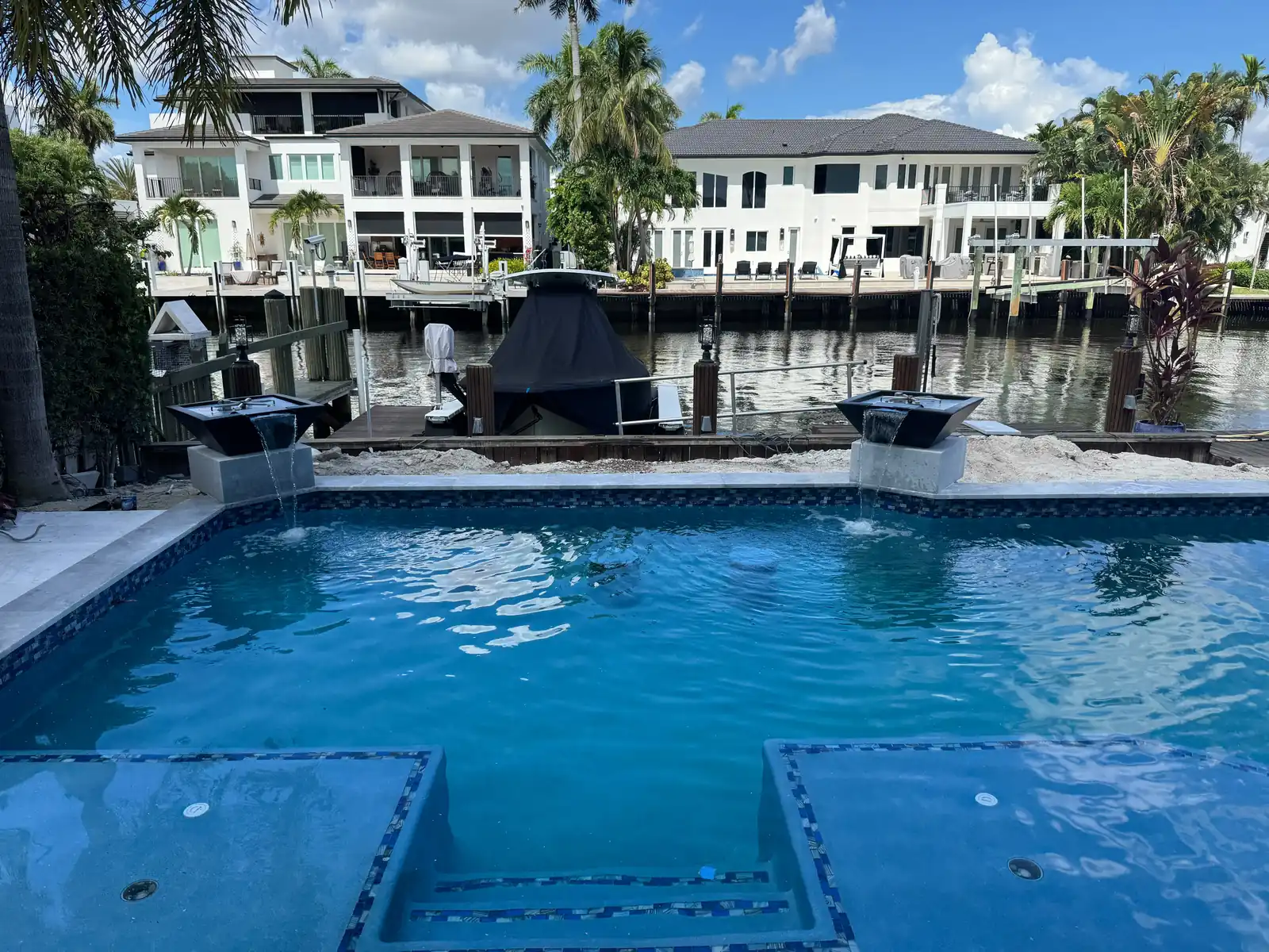 Renovated pool with sun shelf and loungers in Fort Lauderdale